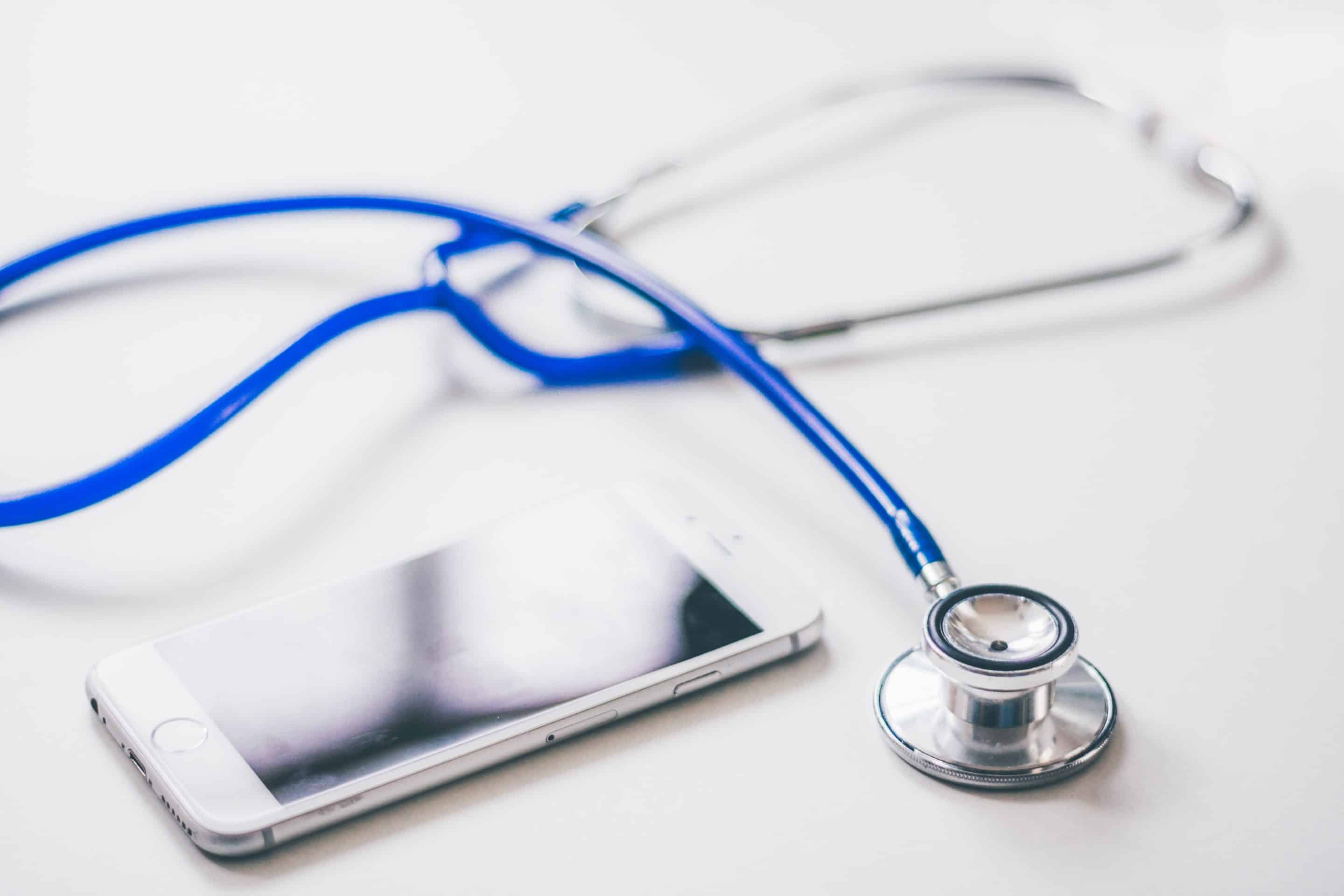 Office space with stethoscope on table of a company providing outsourced medical billing services.